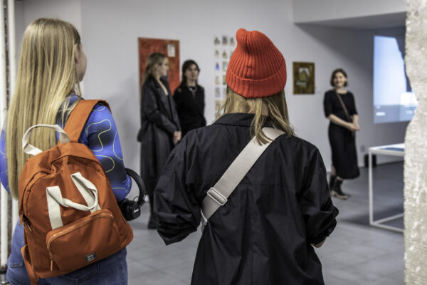 a few women visiting an exhibition of works by Belarussian residents